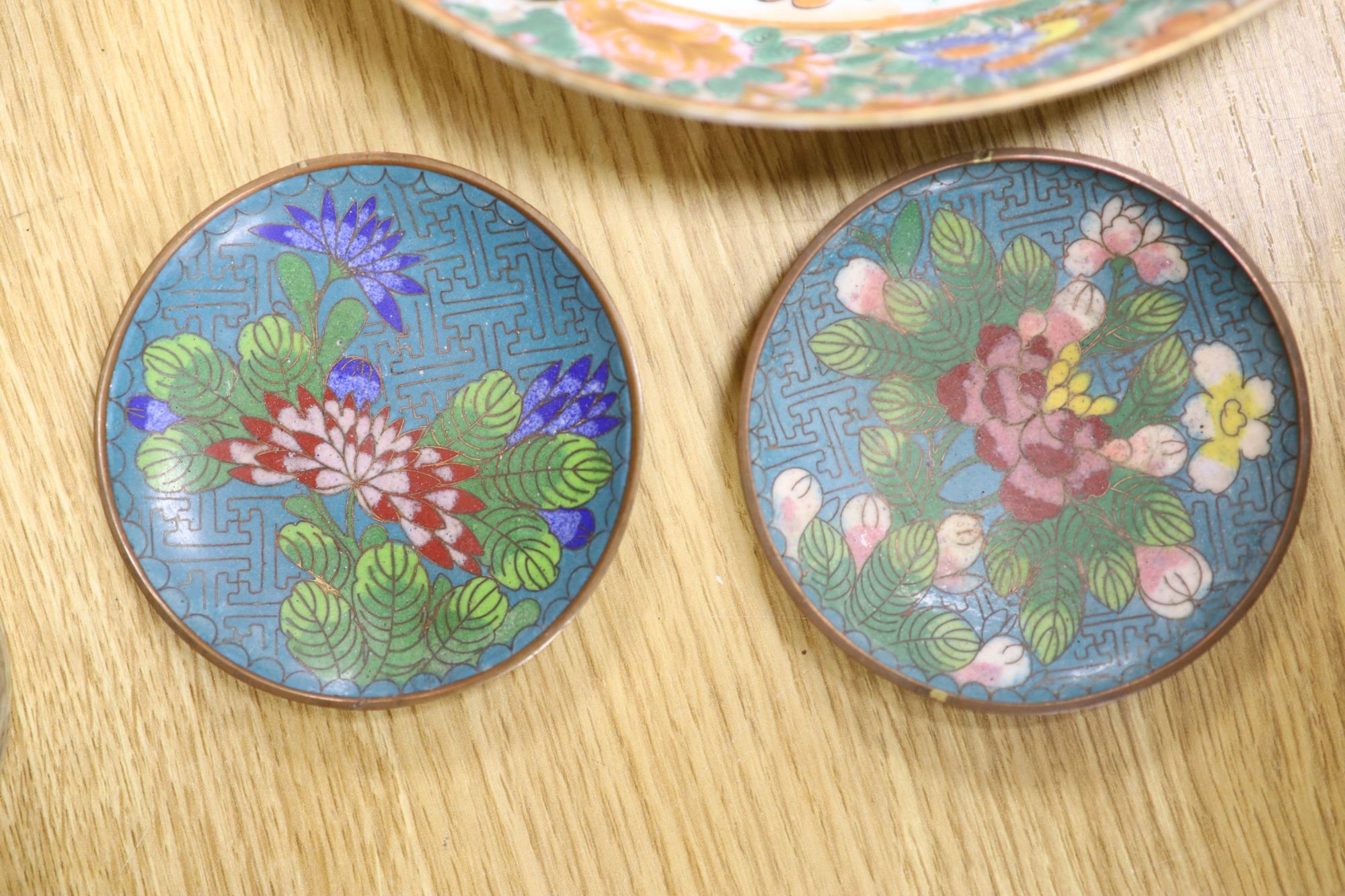 A quantity of Chinese and Japanese ceramics, including a blue and white dragon dish, a Cantonese famille rose dish, four cloisonne pi